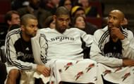 Tony Parker #7, Tim Duncan #21 and Bruce Bowen #12 of the San Antonio Spurs